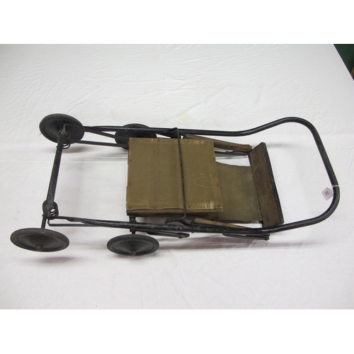 215 - Old folding metal, wood and canvas child's push/wheel chair with solid tyred wheels - 33