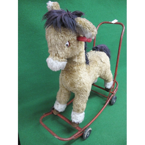 216 - Large child's sit on donkey with handles and a push-a-long or rocker metal frame finished in red - 3... 