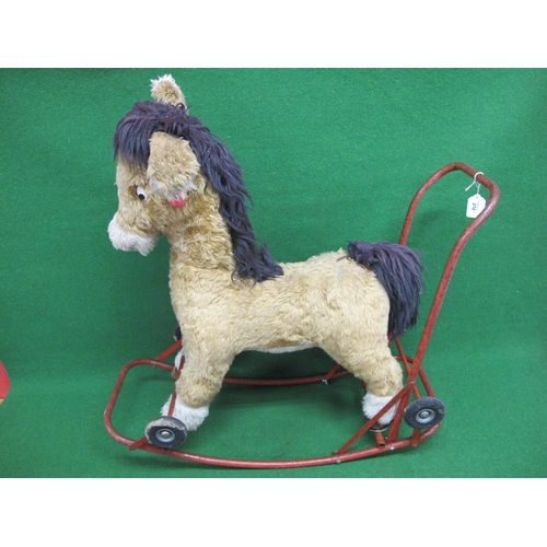 216 - Large child's sit on donkey with handles and a push-a-long or rocker metal frame finished in red - 3... 