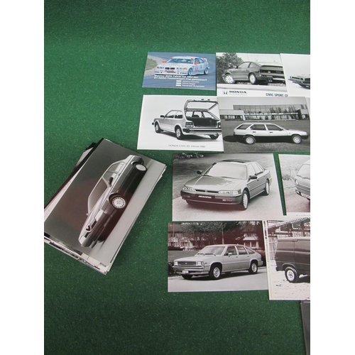 29 - Quantity of mostly black and white publicity photographs of 1980's/1990's cars and vans