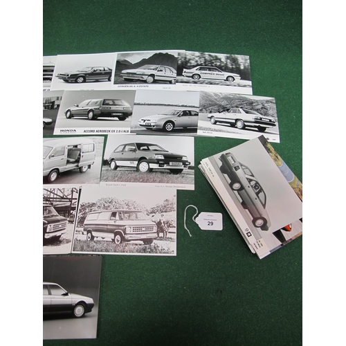 29 - Quantity of mostly black and white publicity photographs of 1980's/1990's cars and vans