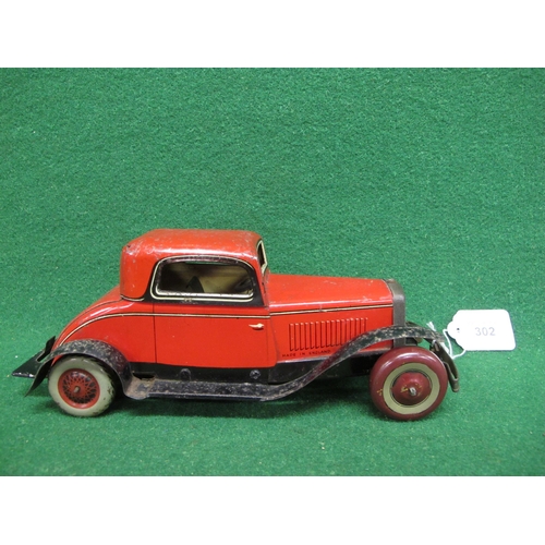 302 - Chad Valley tinplate clockwork two seater saloon in red livery with Royal Warrant on the boot - 10