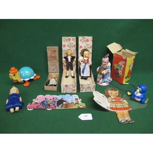 327 - Three boxed Foreign dolls, small Rosebud doll, pull-a-long Fisher-Price tortoise, boxed clown with c... 