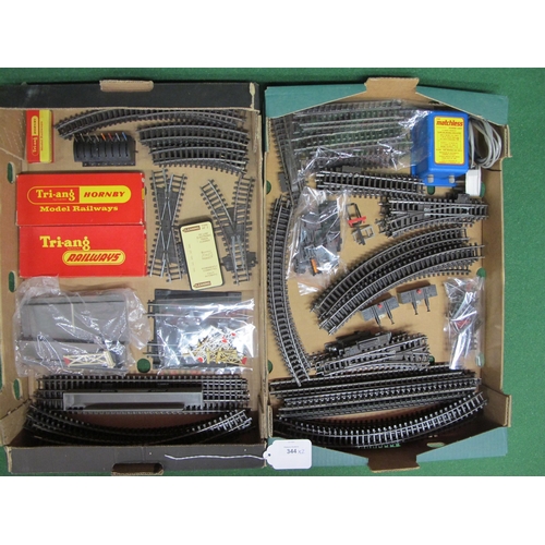 344 - Two boxes of loose Triang Super 4 track parts (approx ninety seven items), two boxed points and a mo... 