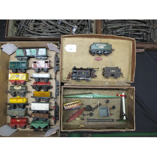 355 - Loft find three suitcases of loose playworn Hornby O gauge to comprise: seventeen wagons, a BR 0-4-0... 