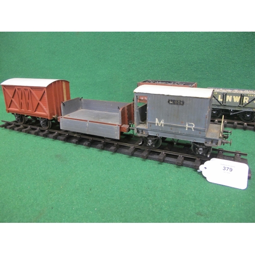 379 - Four wood and metal Gauge 1 four wheel wagons to comprise: LNWR 10 ton Open wagon with stone load, a... 