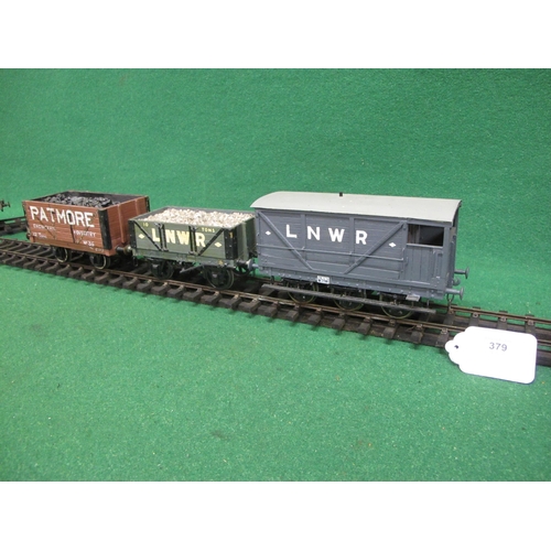 379 - Four wood and metal Gauge 1 four wheel wagons to comprise: LNWR 10 ton Open wagon with stone load, a... 