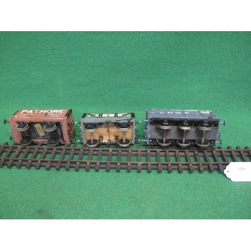 379 - Four wood and metal Gauge 1 four wheel wagons to comprise: LNWR 10 ton Open wagon with stone load, a... 