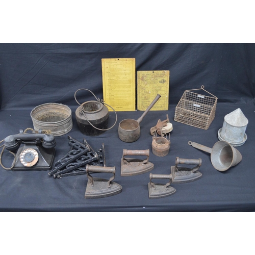 177 - Group of sundry items to include: four flat irons, three iron shelf brackets, Bakelite telephone, wi... 