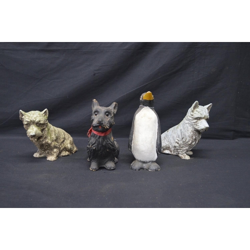 196 - Two spelter figures of seated dogs - 19.5cm x 16.5cm tall together with two Made in Scotland figures... 