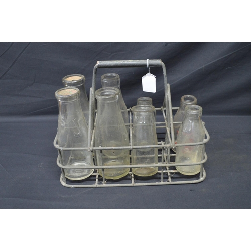 198 - Vintage galvanised milk bottle basket to hold eight bottles together with eight various glass Clock ... 