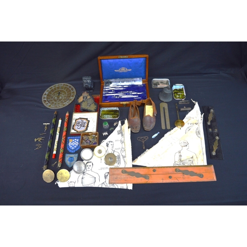 220 - Collection of sundry items to include: pair of leather top clogs, watch keys, Naval badges and brass... 