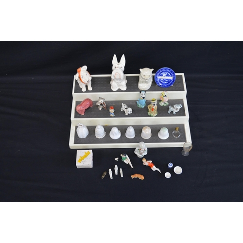 234 - Group of Disney and other Wade Whimsies together with two Beswick dogs, candle snuffers and a miniat... 