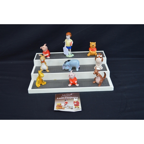 235 - John Beswick group of nine Winnie the Pooh figures to comprise: Christopher Robin, Winnie the Pooh, ... 