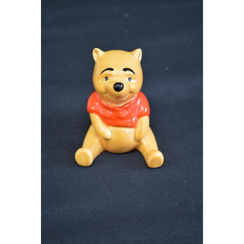 235 - John Beswick group of nine Winnie the Pooh figures to comprise: Christopher Robin, Winnie the Pooh, ... 