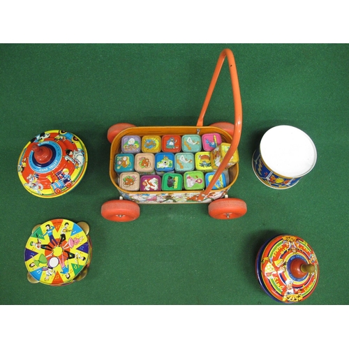 153 - Five colourful tinplate items from Chad Valley - England to comprise: push-a-long trolley containing... 