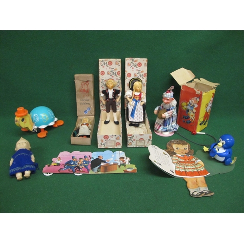 158 - Three boxed Foreign dolls, small Rosebud doll, pull-a-long Fisher-Price tortoise, boxed clown with c... 