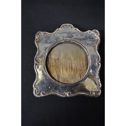 167 - Oval silver photograph frame, hallmarked for Birmingham - 21cm wide together with one other silver p... 