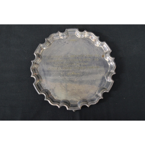 168 - Circular silver salver with shaped edge and standing on scroll feet, hallmarked for Sheffield and en... 