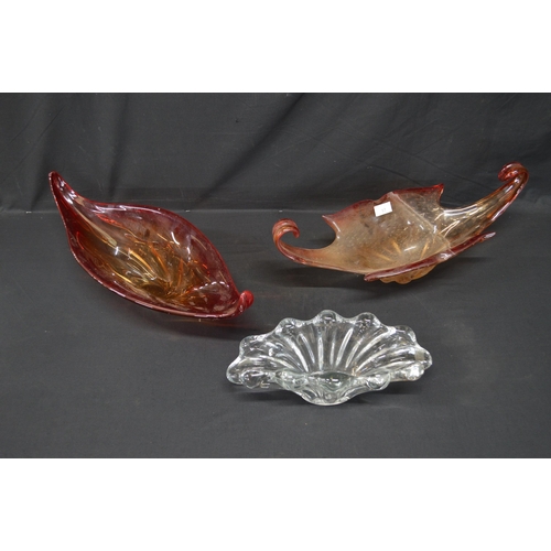 17 - Three Art Glass bowls to comprise: clear glass with scalloped ends - 35cm long, red glass with bubbl... 