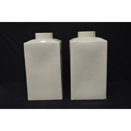 185 - Pair of square form cream ground floor vases - 57.7cm tall