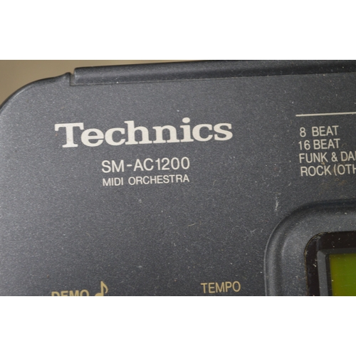 21 - Technics SM-AC1200 Midi Orchestra with adapter, midi and jack cable