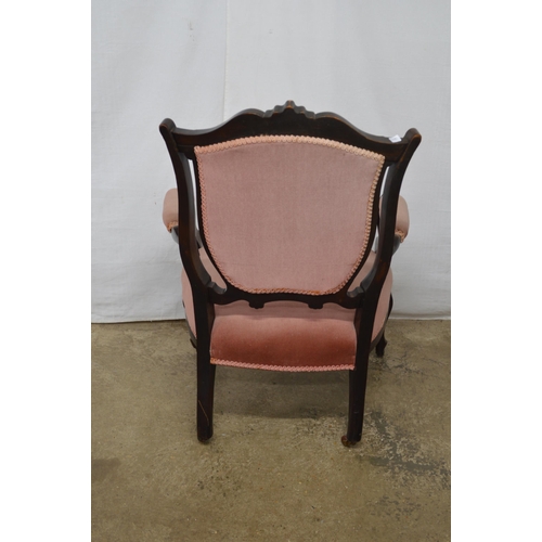 271 - Dark stained open armchair having carved cresting rail, padded back, seat and arm rests, standing on... 