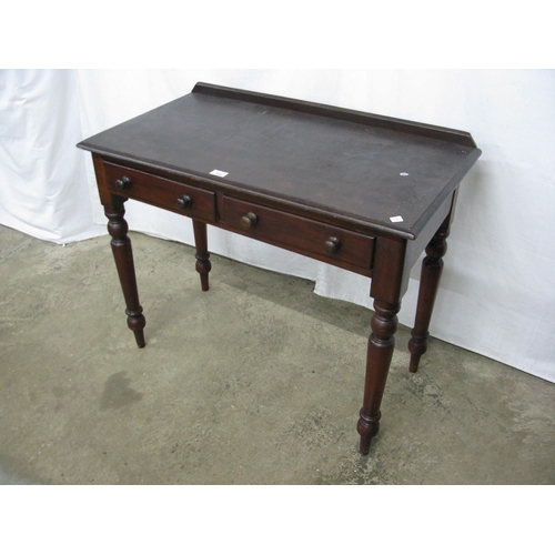 274 - Mahogany side table having a raided back over two drawers, standing on turned legs - 92cm x 48cm x 7... 