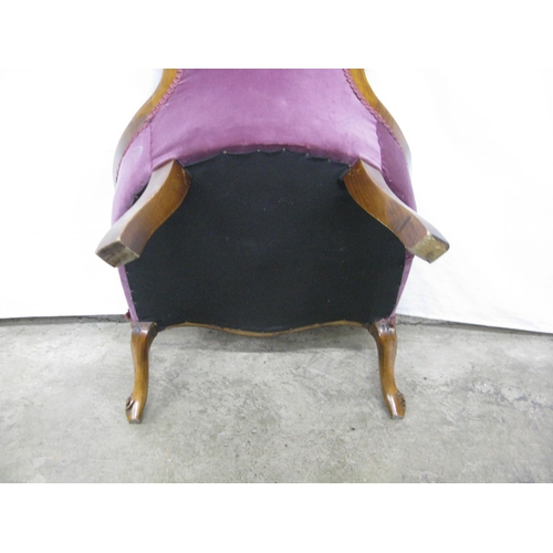 275 - Walnut button back nursing chair having padded back and seat, standing on carved cabriole front legs... 