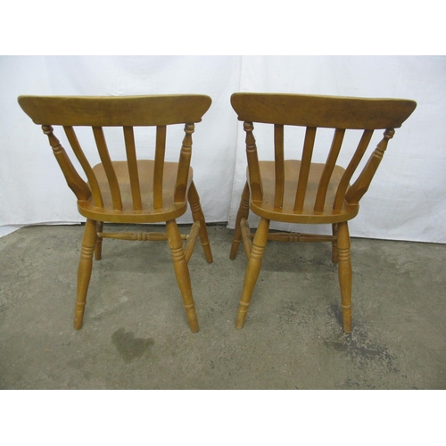 276 - Pair of beech country kitchen chairs having slat backs, standing on turned legs with stretchers - 47... 