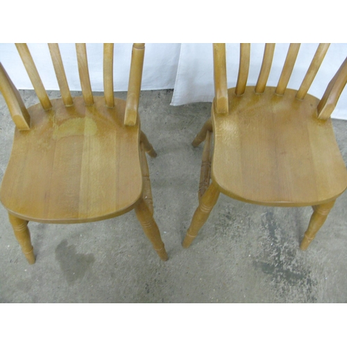 276 - Pair of beech country kitchen chairs having slat backs, standing on turned legs with stretchers - 47... 