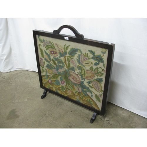 283 - Stained wood frame fire screen having a glazed tapestry panel with foliage design - 81cm x 22cm x 85... 