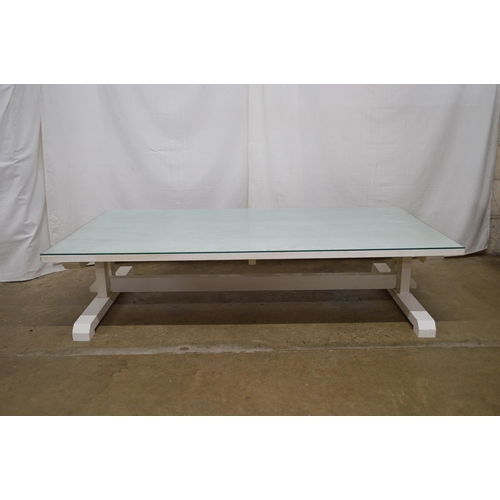 286 - Large painted pine coffee table having four plank top with glass cover - 152cm x 86cm x 36cm tall