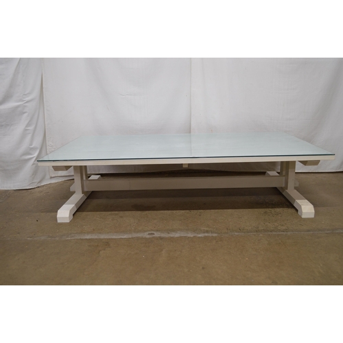 287 - Large painted pine coffee table having a four plank top with glass cover - 152cm x 86cm x 36cm tall