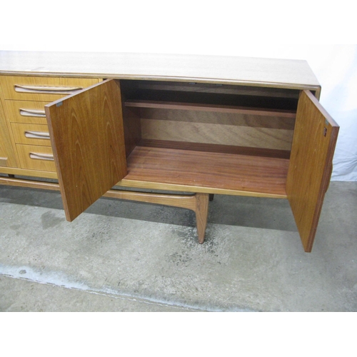 291 - G-Plan Fresco teak sideboard having four central drawers (one cutlery) flanked by two cupboards with... 