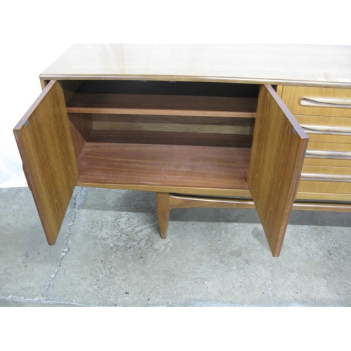 291 - G-Plan Fresco teak sideboard having four central drawers (one cutlery) flanked by two cupboards with... 