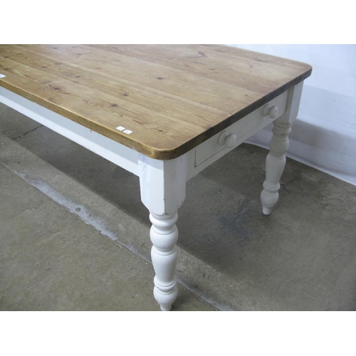 292 - Pine country kitchen dining table having a six plank top over a single drawer, standing on turned le... 