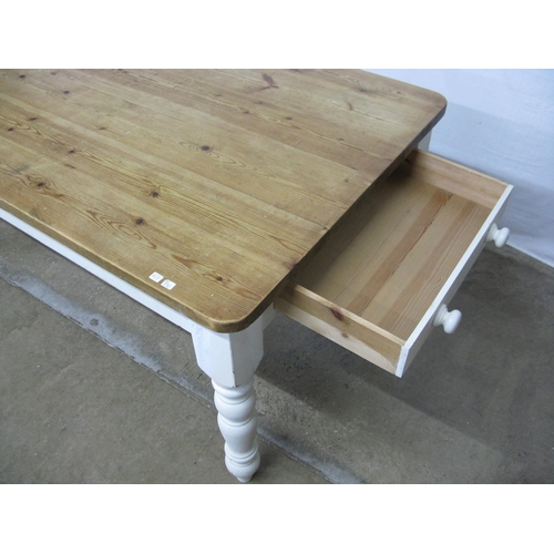 292 - Pine country kitchen dining table having a six plank top over a single drawer, standing on turned le... 