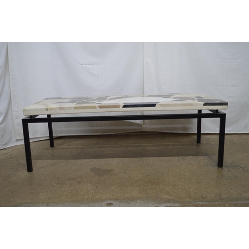 293 - Heavy granite and marble Terrazzo style coffee table, standing on square metal supports - 120cm x 50... 