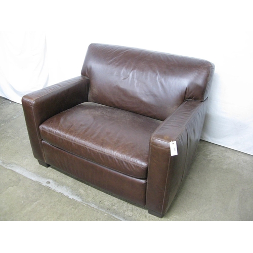 295 - Next leather Armchair And A Half having padded back and seat, standing on block feet - 114cm x 89cm ... 