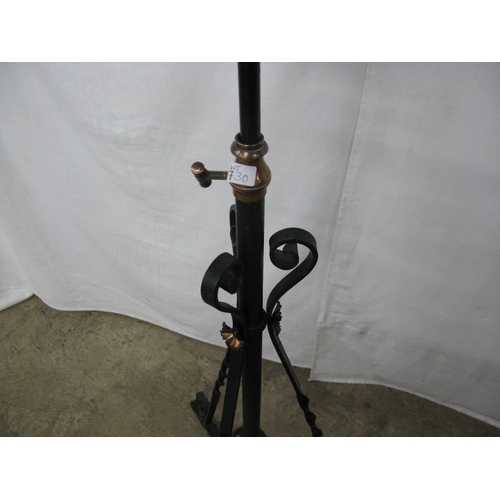 304 - Wrought iron telescopic oil lamp standard, standing on scrolled tripod base together with glass chim... 