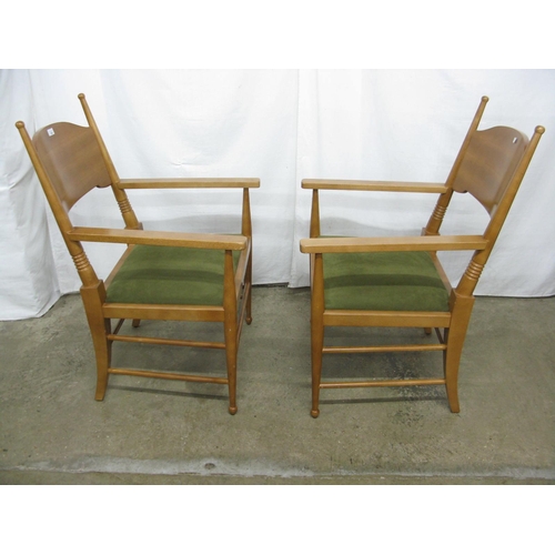 305 - Pair of modern beech elbow chairs having shaped backs and padded seats, standing on round tapering l... 