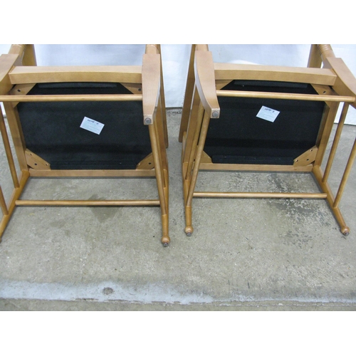 305 - Pair of modern beech elbow chairs having shaped backs and padded seats, standing on round tapering l... 