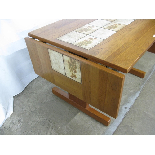 306 - Possibly Gangso Mobler teak and inset tile top extending dining table having floral tiles and two re... 