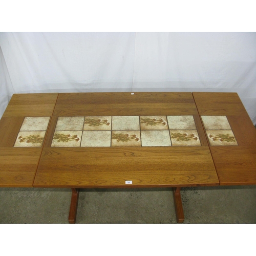 306 - Possibly Gangso Mobler teak and inset tile top extending dining table having floral tiles and two re... 