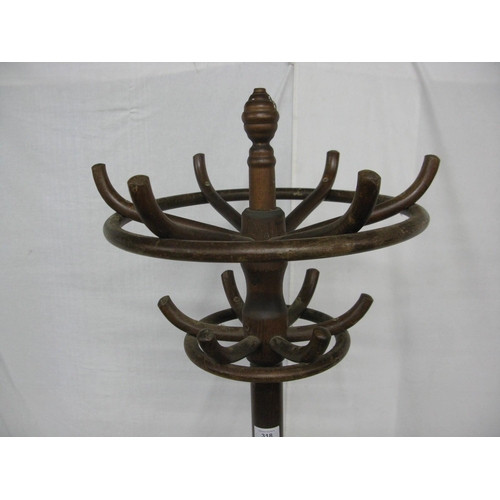 318 - Bentwood hat stand having a ring of six hooks over another ring of six hooks, standing on splayed su... 