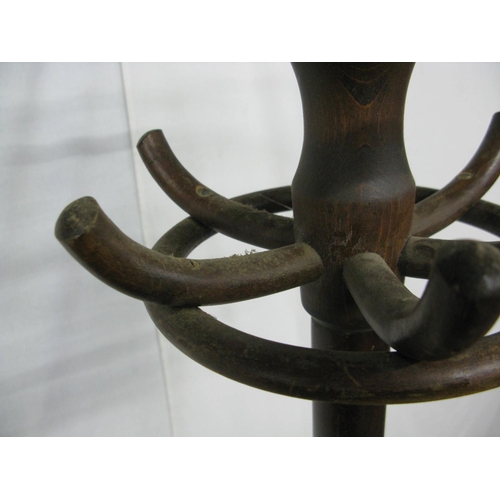 318 - Bentwood hat stand having a ring of six hooks over another ring of six hooks, standing on splayed su... 