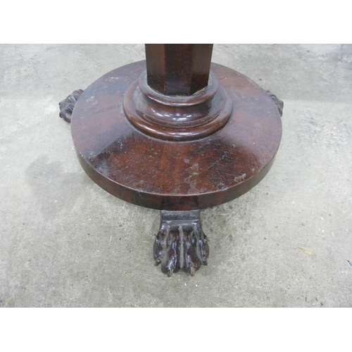 319 - Mahogany fold over card table, the top opening to a circular green baize, standing on an octagonal c... 