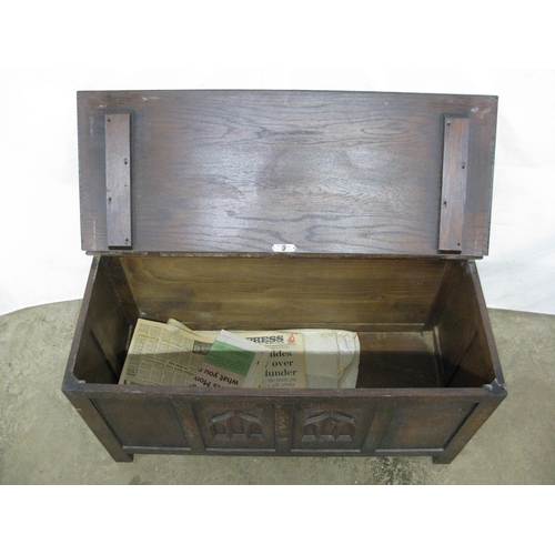 325 - Webber Furniture oak coffer, the hinged lift top lid opening to a storage space with two carved fron... 