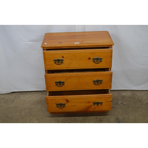 339 - Modern pine chest of three drawers, standing on a plinth base - 63cm x 34cm x 74cm tall (one handle ... 